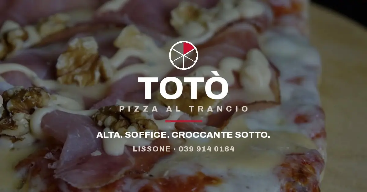 Totò Pizza al Trancio: foto ravvicinata di una teglia, «Alta. Soffice. Croccante sotto.»